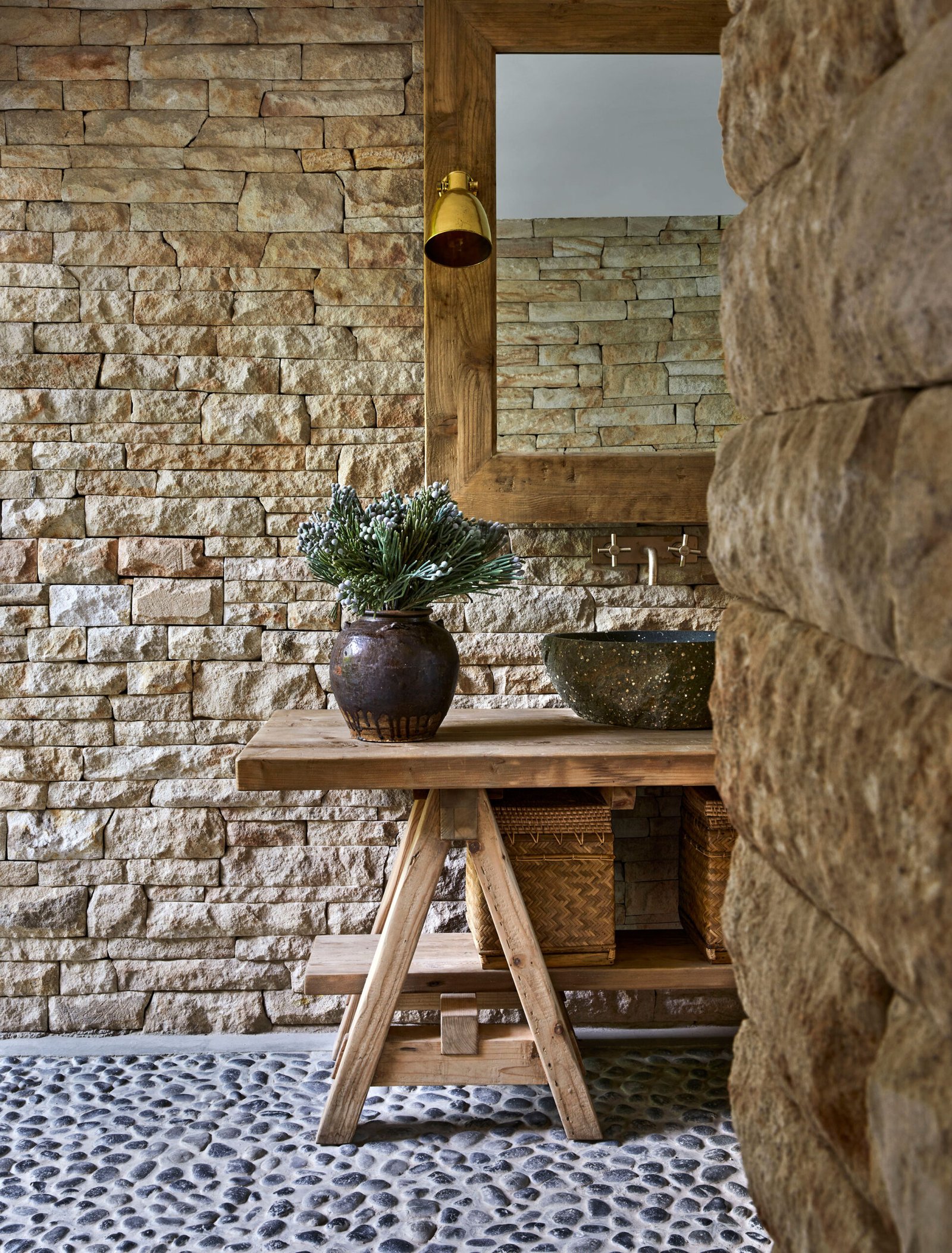 wooden bench with basalt wash basin in bathroom