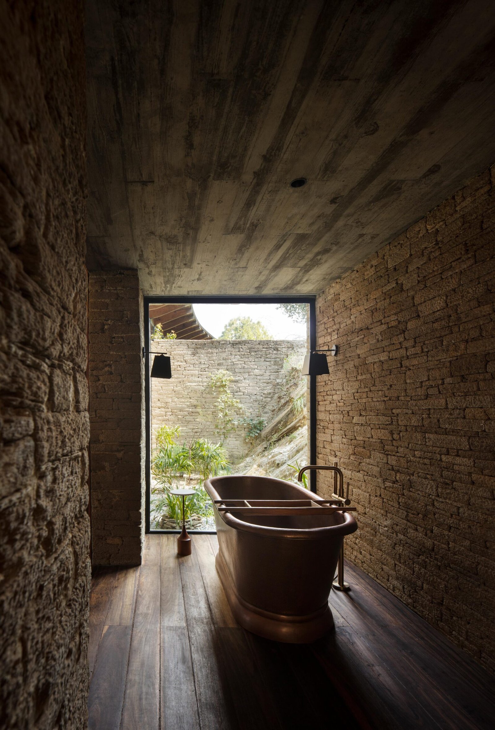 copper standalone bathtub in mountain home