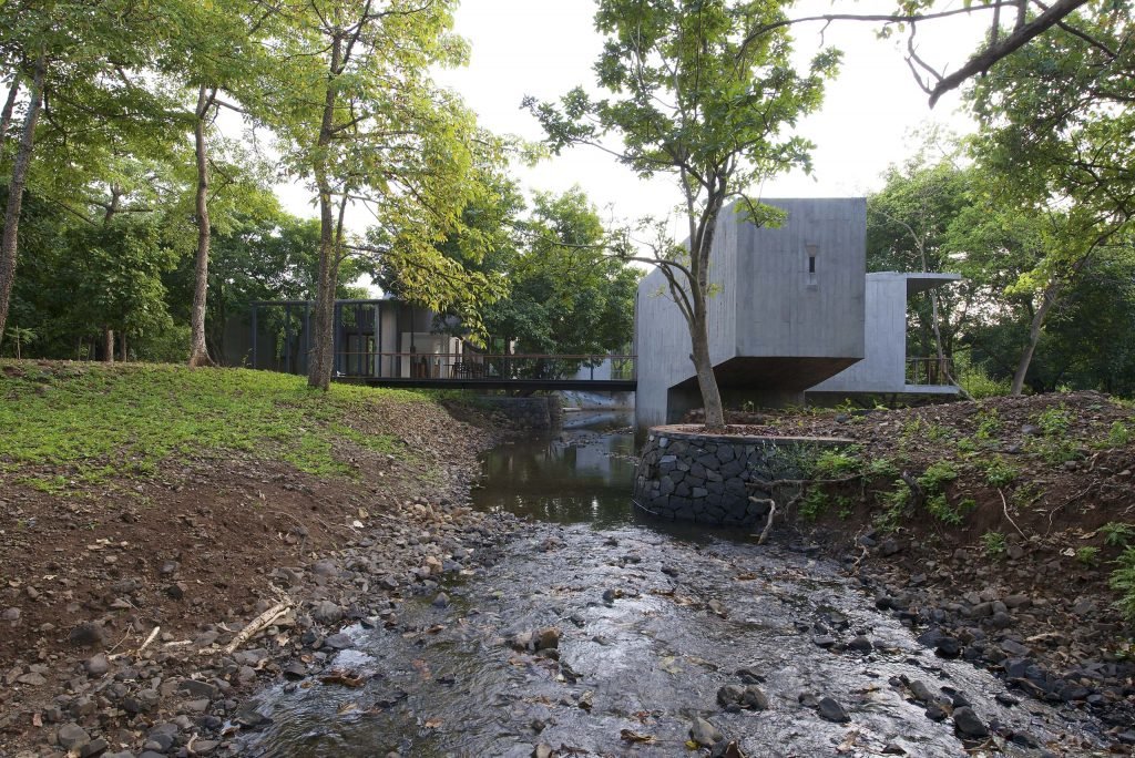 House on a stream view from stream Alibaug Domus india